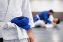 What Belt Comes After White in BJJ? Blue.